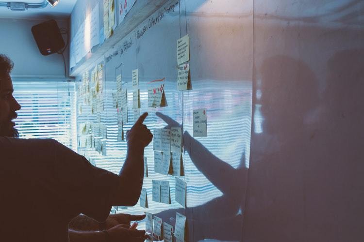 A man pointing at a whiteboard